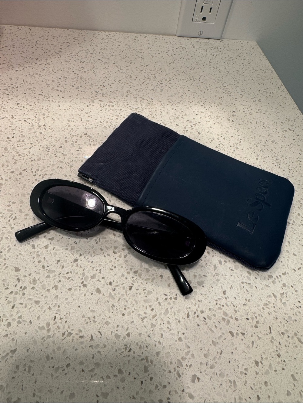 Le Specs Glossy Black Oval Sunglasses with Navy Sleeve
